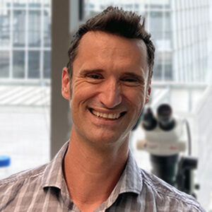 Formal headshot of faculty member Brock Grill.