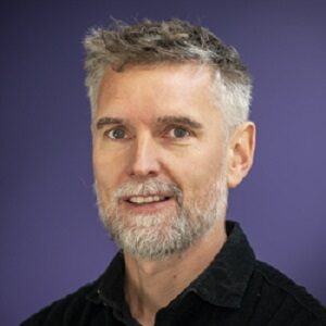 Formal headshot of faculty member Christoph Grundner.
