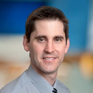 Formal headshot of faculty member Shaun Jackson.