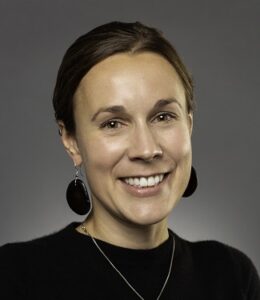 Formal headshot of faculty member Elia Tait Wojno.