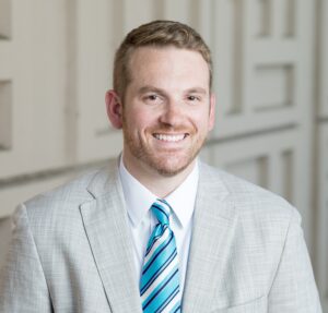 Formal headshot of faculty member Nicholas Riley.