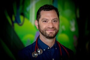 Formal headshot of faculty member Lucas Hoffman.