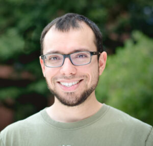 Formal headshot of faculty member Phil Abitua.