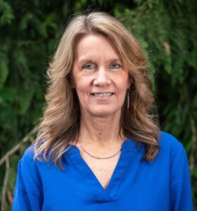 Formal headshot of faculty member Sue Biggins.