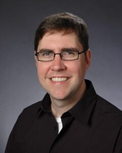 Formal headshot of faculty member Daniel Campbell.
