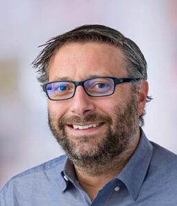 Formal headshot of faculty member Jarrod Dudakov.