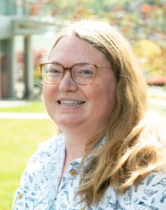 Formal headshot of faculty member Maitreya Dunham.