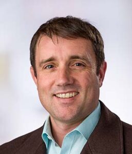 Formal headshot of faculty member Scott Furlan.