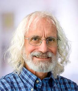 Formal headshot of faculty member Philip Greenberg.