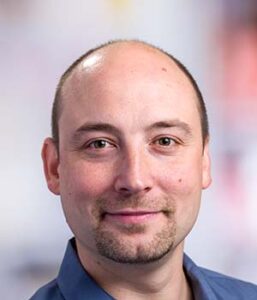 Formal headshot of faculty member Mark Headley.
