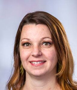 Formal headshot of faculty member Meghan Koch.