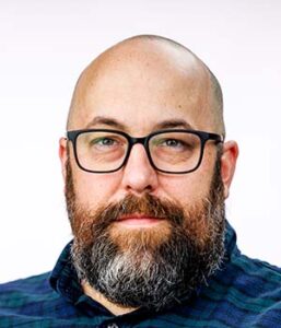 Formal headshot of faculty member Andrew McGuire.