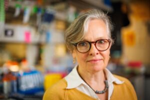 Formal headshot of faculty member Cecilia Moens in lab.