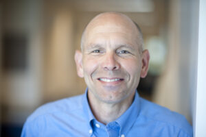Formal headshot of faculty member Peter Nelson.