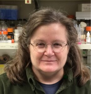 Formal headshot of faculty member Susan Parkhurst in lab.