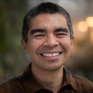 Formal headshot of faculty member Adam Steinbrenner.