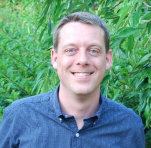 Formal headshot of faculty member Larry Zweifel.