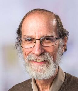 Formal headshot of faculty member Adam Geballe.