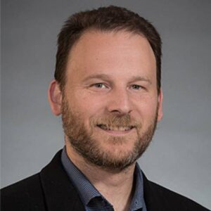 Formal headshot of faculty member Geoffrey Baird.