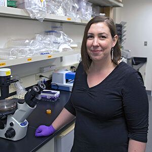 Formal headshot of faculty member Alice Berger in lab.