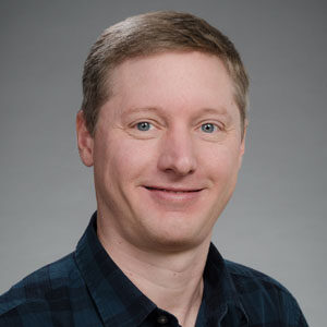Formal headshot of faculty member Jason Smith.