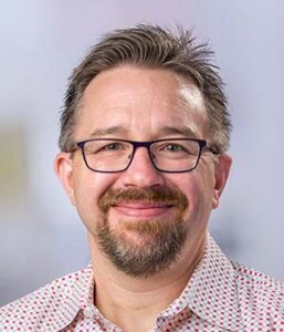 Formal headshot of faculty member Patrick Paddison.