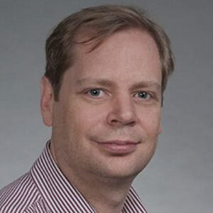 Formal headshot of faculty member Paul Phillips.