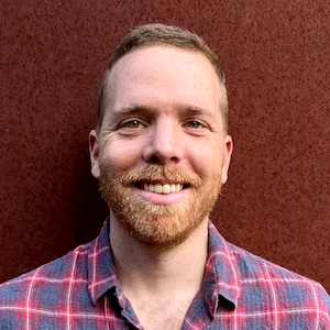 Formal headshot of faculty member John Ray.