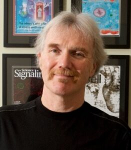 Formal headshot of faculty member John Scott.