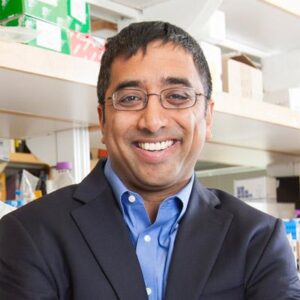 Formal headshot of faculty member Jay Shendure in lab.