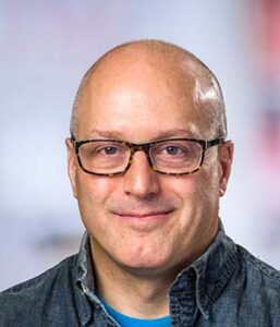 Formal headshot of faculty member Roland Strong.
