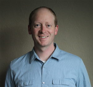 Formal headshot of faculty member Joshua Woodward.