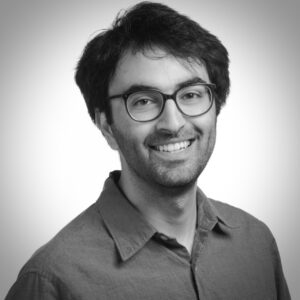 Formal black and white headshot of faculty member Pejman Mohammadi.