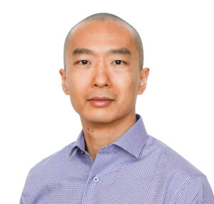Formal headshot of faculty member Yijie Geng.