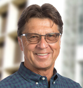 Formal headshot of faculty member Bruce Torbett.