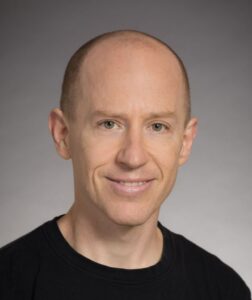 Formal headshot of faculty member Joshua Vaughan.