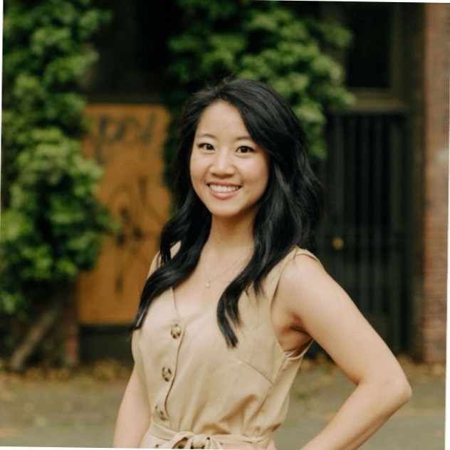 Professional headshot of MCB staff member Bao-Han Nguyen with a nature background.