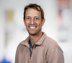 Formal headshot of faculty member Dr. Sylvain Simon